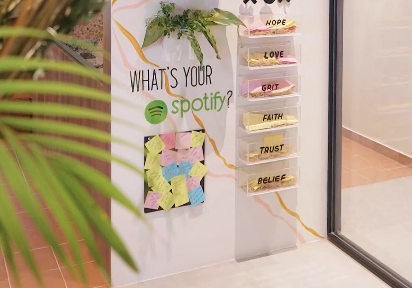 The community wall with the Spotify board and notes from members