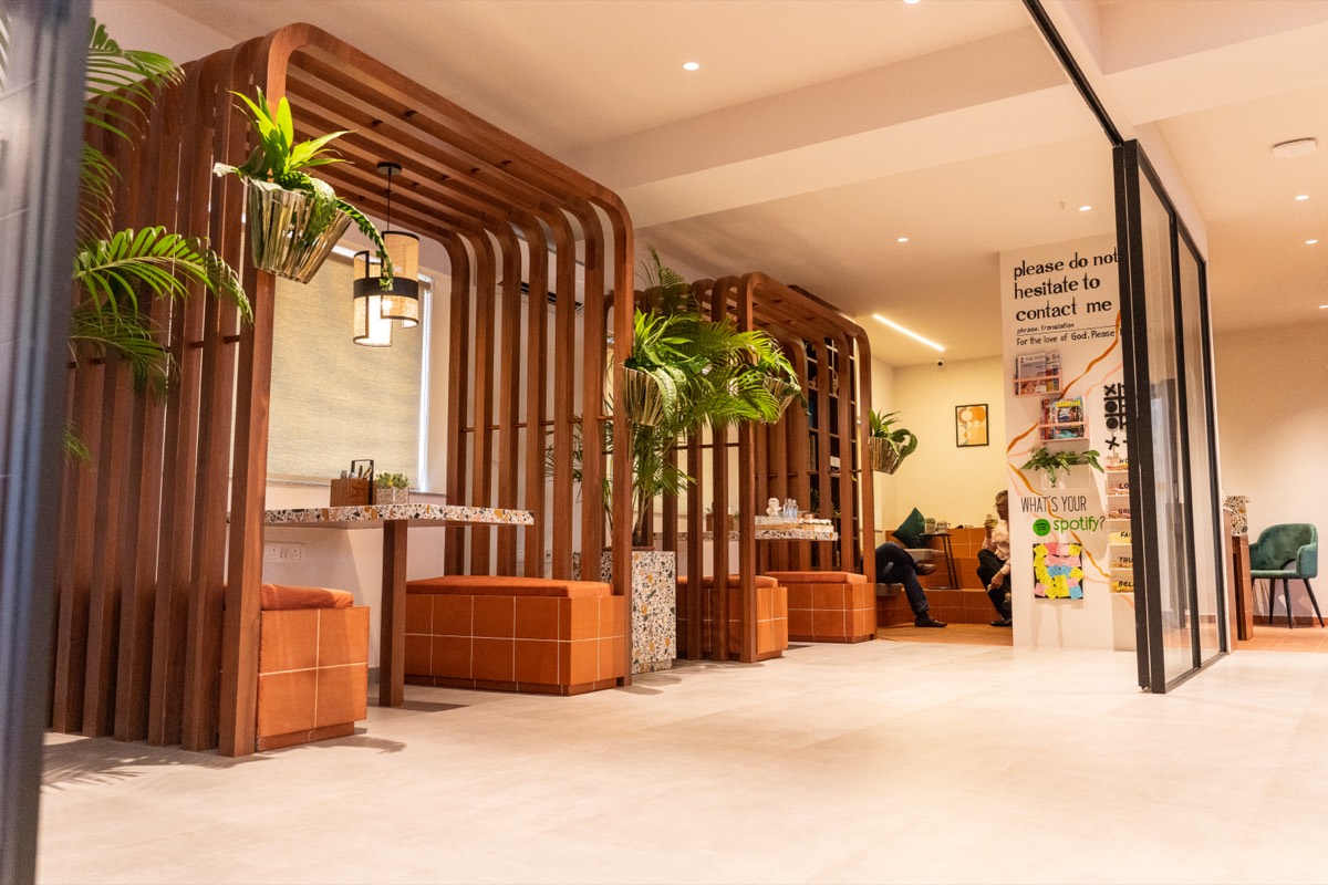 Booth seating with terracotta bases and terrazzo tables